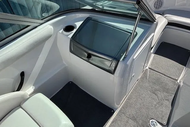 Slide: The Image of 2012 Yamaha Boats SX190 interior with seating and storage compartment. - 16