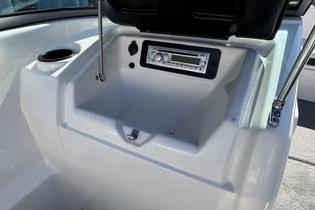 Slide: The Image of 2012 Yamaha SX190 boat dashboard with stereo system and cup holder. - 17