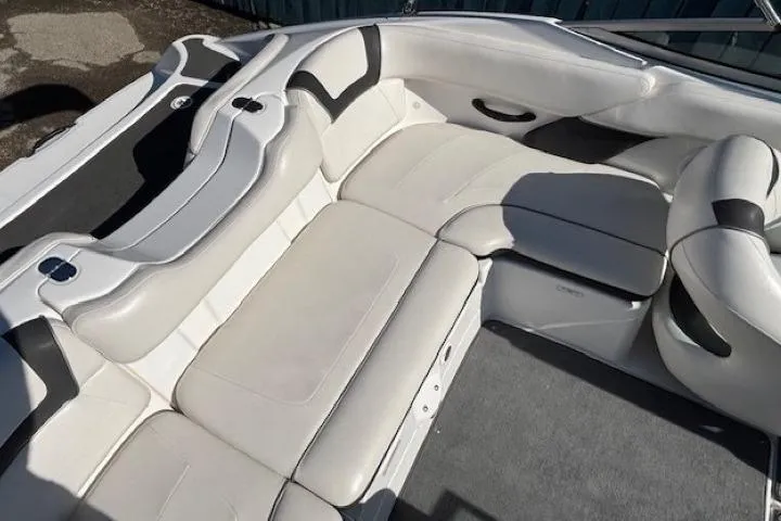 Slide: The Image of 2012 Yamaha Boats SX190 interior with white leather seating and modern design. - 21