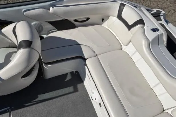 Slide: The Image of 2012 Yamaha Boats SX190 interior with white and black seating. - 23