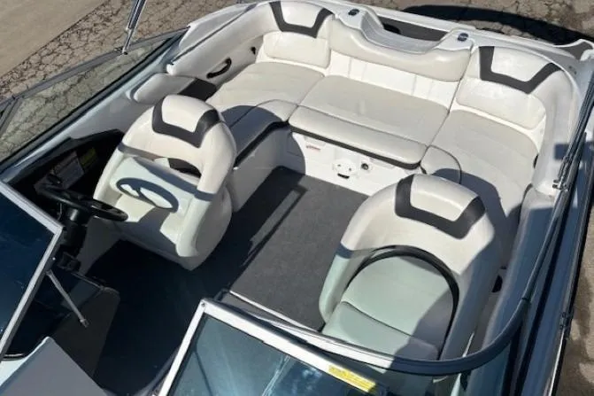 Slide: The Image of 2012 Yamaha Boats SX190 interior with white seating and steering wheel. - 9