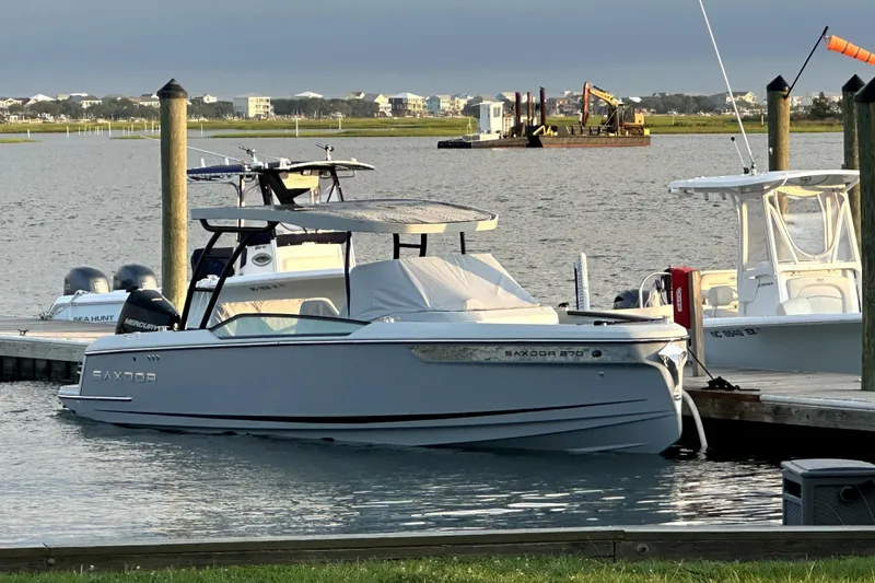 The Image of 2024 Saxdor 320 GTO boat docked in a marina, showcasing sleek design and modern features. - 0