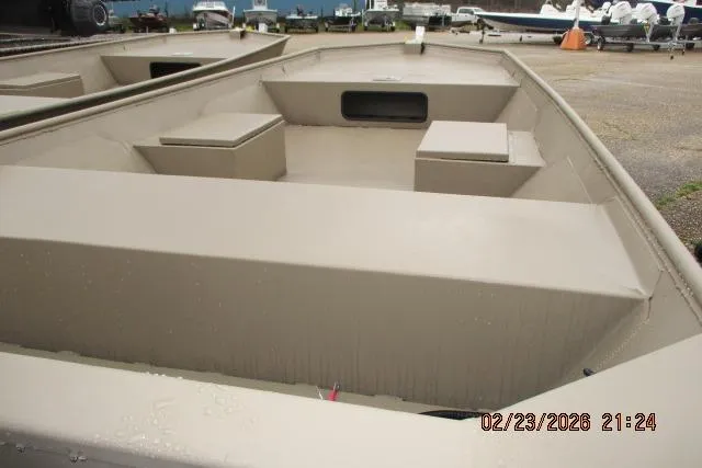 Slide: The Image of 2026 Weldcraft 1552 Cajun Tunnel Hull boat, beige color, docked outdoors. - 2