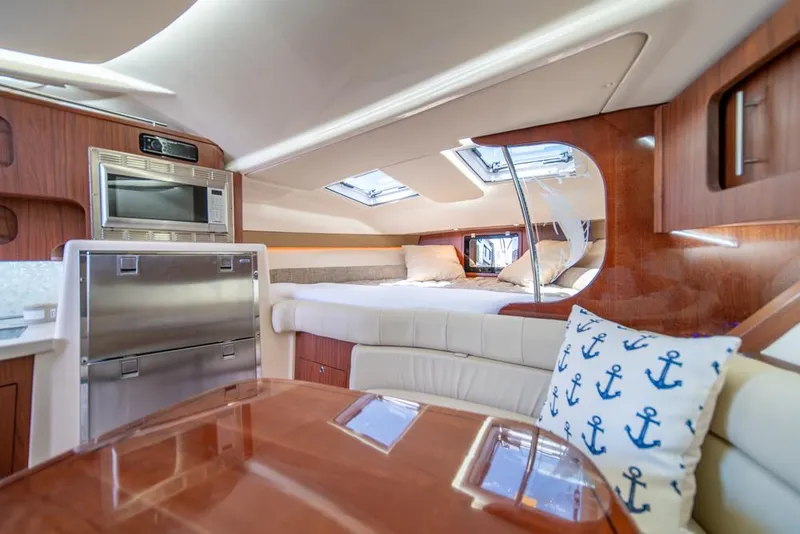 Slide: The Image of Luxurious interior of 2019 Grady-White Express boat with modern amenities and cozy seating. - 18