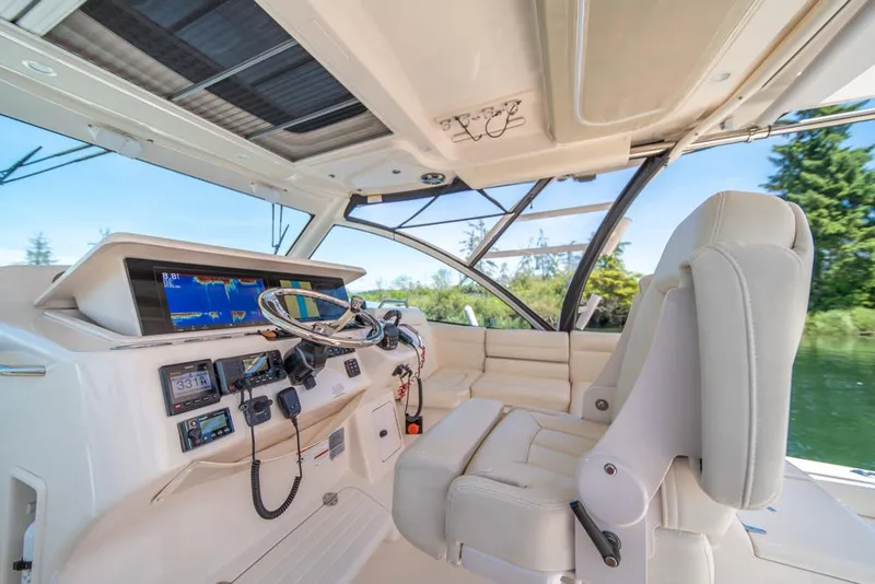Slide: The Image of 2019 Grady-White Express boat cockpit with advanced navigation systems and luxurious seating. - 36
