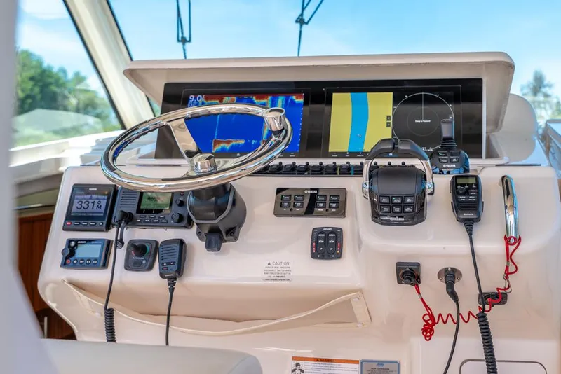 Slide: The Image of 2019 Grady-White Express boat helm with advanced navigation and communication systems. - 39