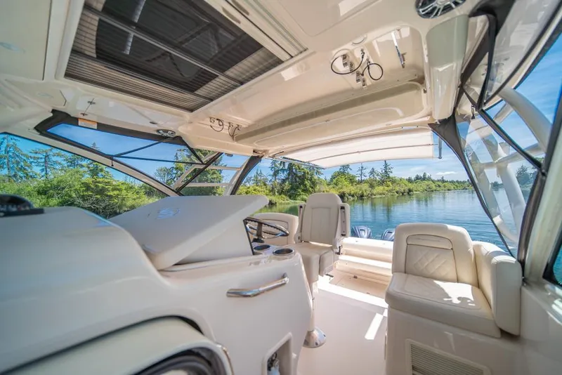 Slide: The Image of Interior of 2019 Grady-White Express boat with luxurious seating and scenic water view. - 43