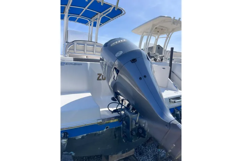 Slide: The Image of 2018 Robalo R222 Explorer boat with powerful outboard motor and blue canopy. - 10