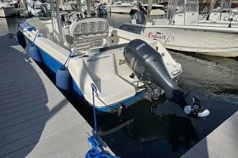 Slide: The Image of 2018 Robalo R222 Explorer boat docked with Yamaha outboard motor. - 5