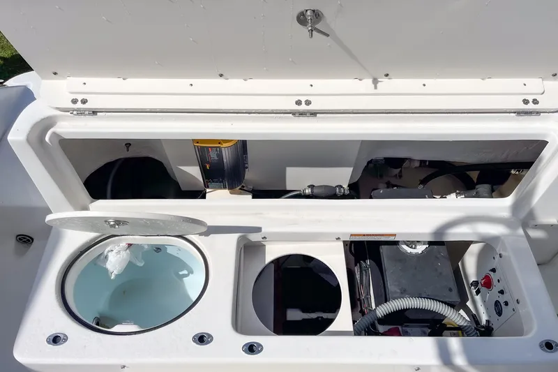 Slide: The Image of 2018 Robalo R222 Explorer boat storage compartments and equipment layout. - 9