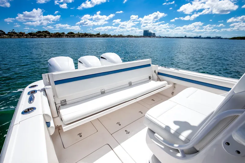 Slide: The Image of 2017 Intrepid 375 Center Console boat with seating, on a sunny day, overlooking calm waters. - 16