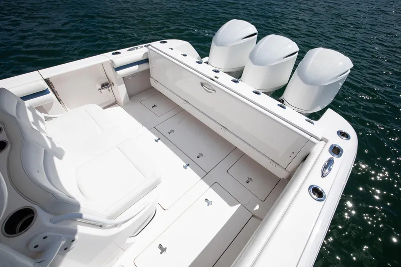 Slide: The Image of 2017 Intrepid 375 Center Console boat with triple engines on water. - 19