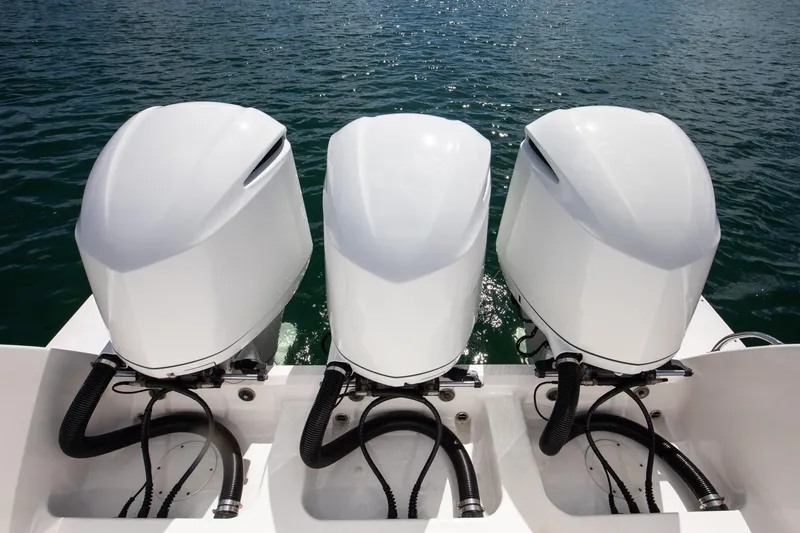 Slide: The Image of Three powerful outboard motors on a 2017 Intrepid 375 Center Console boat. - 20