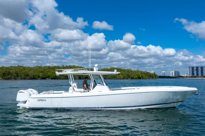 Slide: The Image of 2017 Intrepid 375 Center Console boat cruising on a sunny day with blue skies. - 25