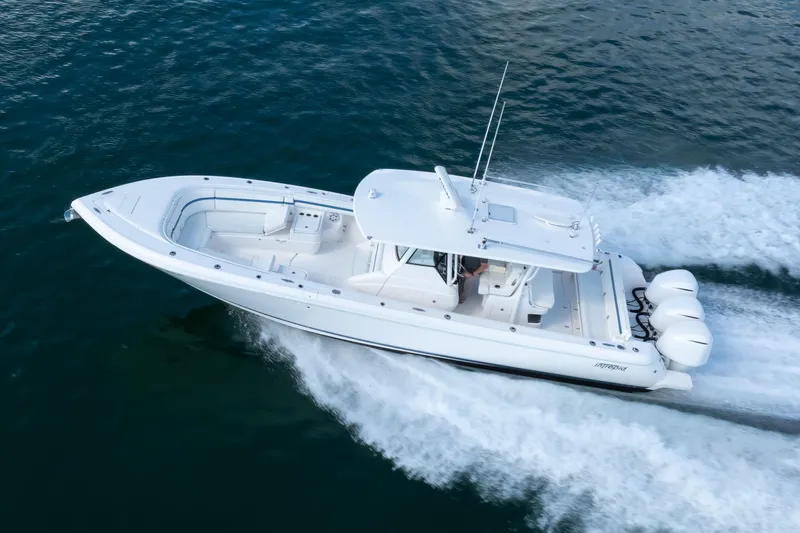 Slide: The Image of 2017 Intrepid 375 Center Console boat cruising on open water. - 27