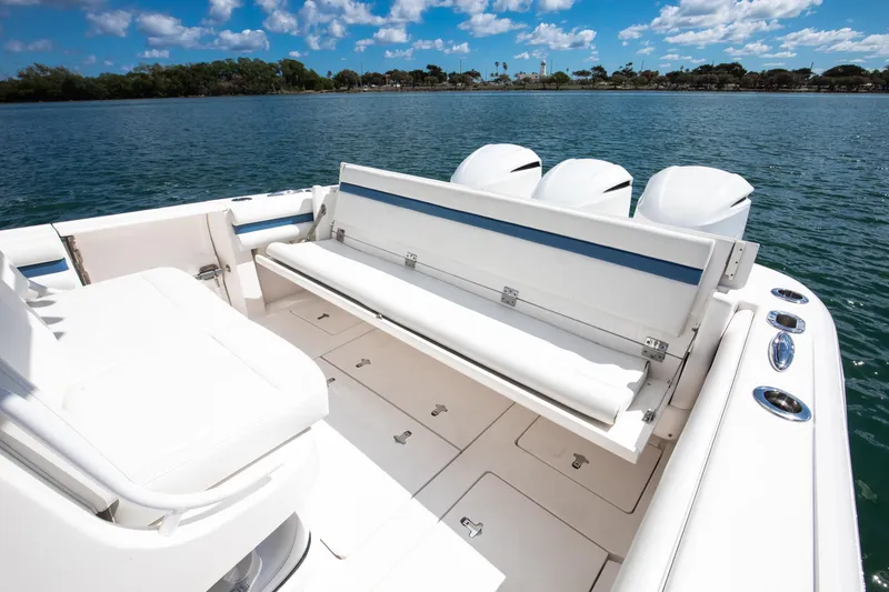 Slide: The Image of 2017 Intrepid 375 Center Console boat with seating, on a sunny day by the water. - 3