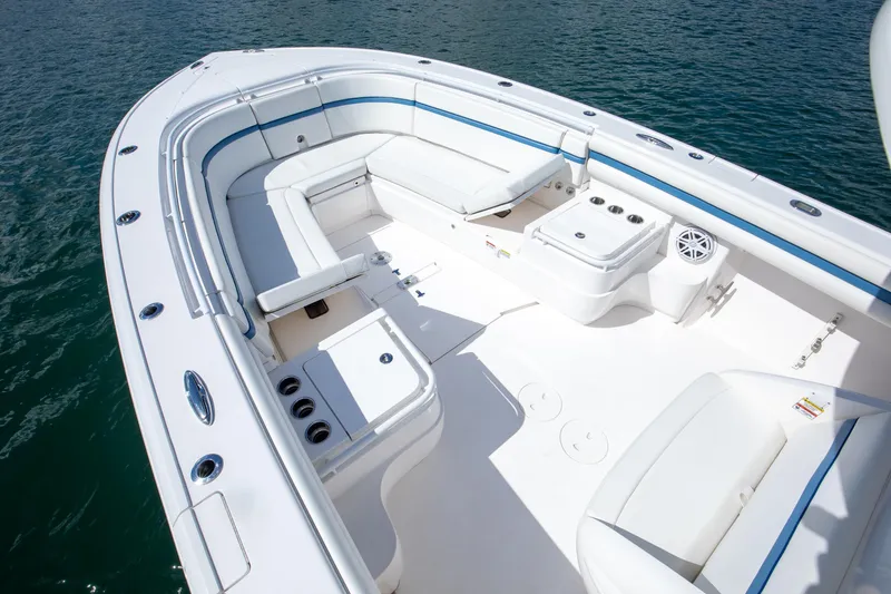 Slide: The Image of 2017 Intrepid 375 Center Console boat with spacious seating and sleek design on water. - 6