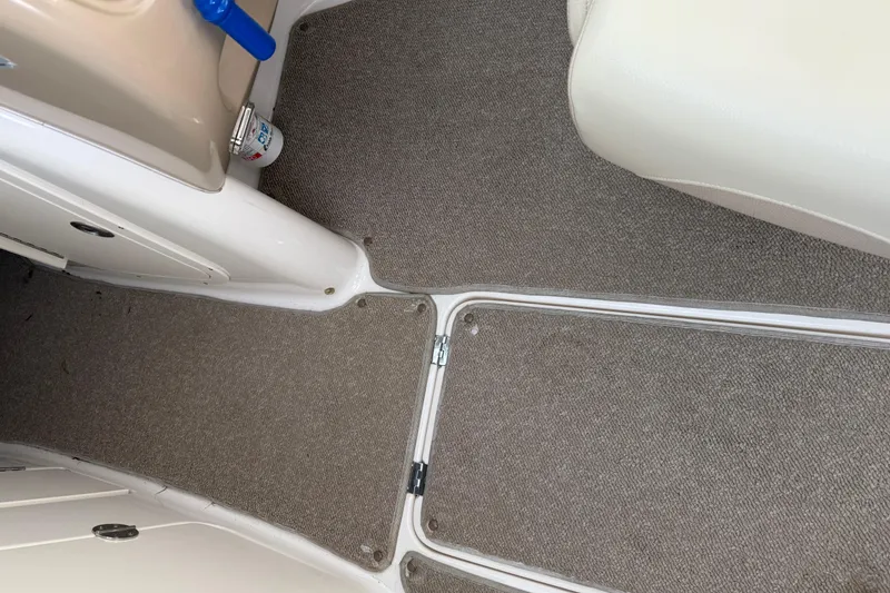 Slide: The Image of Interior view of 2005 Chaparral Sunesta 236 boat with carpeted flooring. - 12