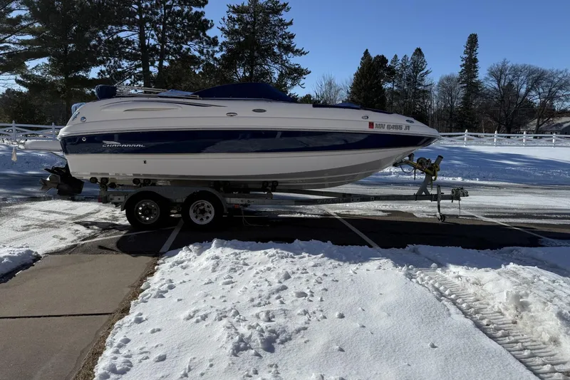 Slide: The Image of 2005 Chaparral Sunesta 236 boat on trailer in snowy landscape. - 2