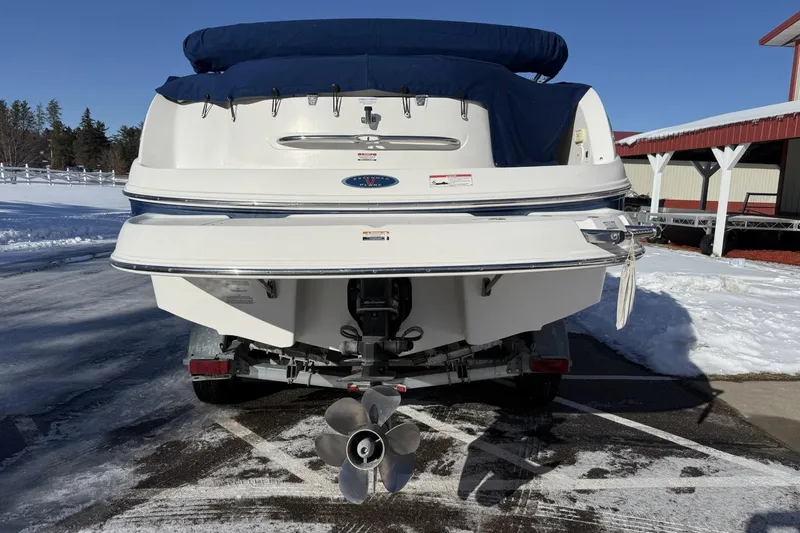 Slide: The Image of 2005 Chaparral Sunesta 236 boat on trailer, rear view, in snowy outdoor setting. - 3