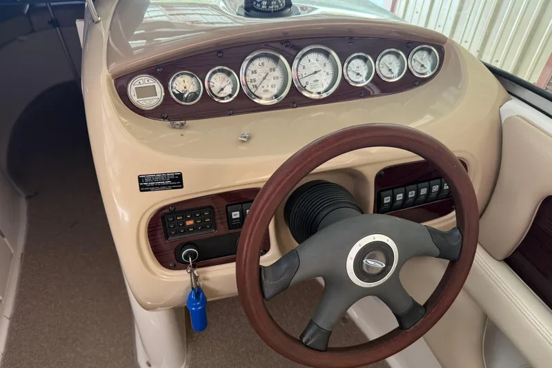 Slide: The Image of 2005 Chaparral Sunesta 236 dashboard with gauges and steering wheel. - 8