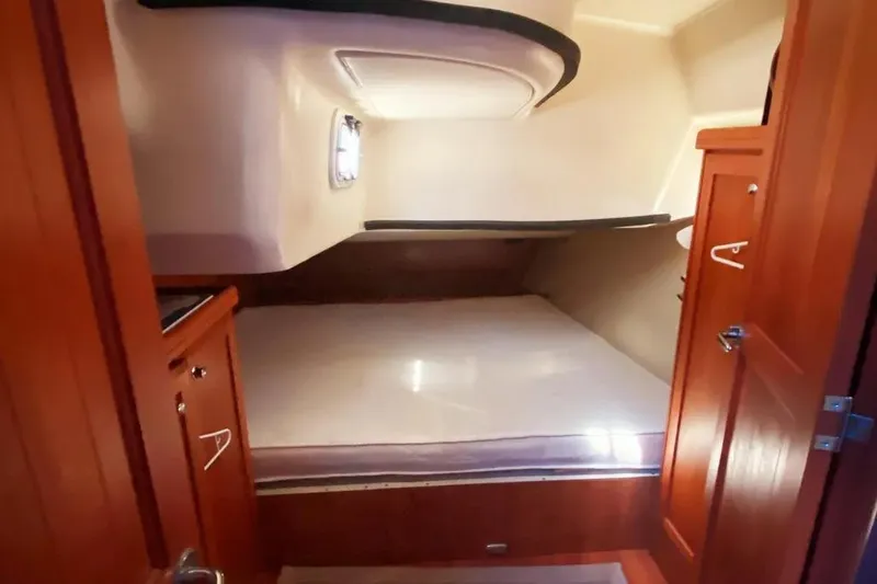 Slide: The Image of Cozy cabin interior of 2012 Hunter Aft Cockpit 50 sailboat with wooden cabinetry. - 19