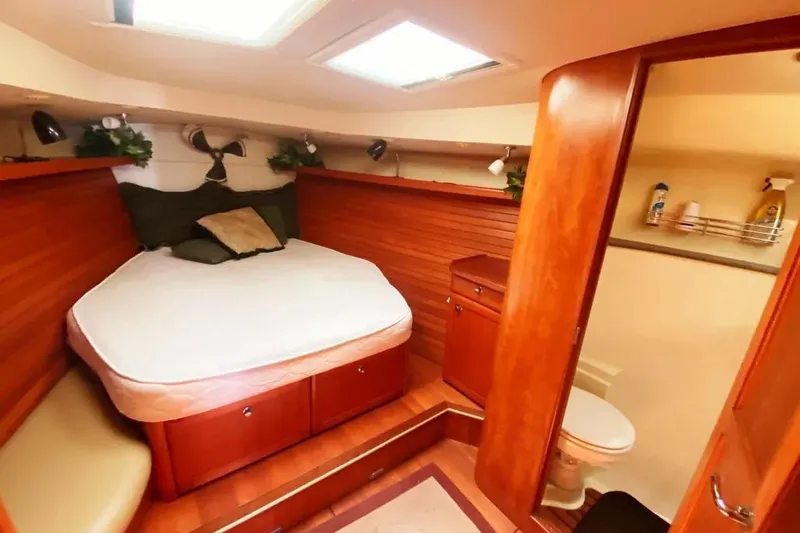 Slide: The Image of Cozy cabin interior of 2012 Hunter Aft Cockpit 50 yacht with bed and bathroom. - 23
