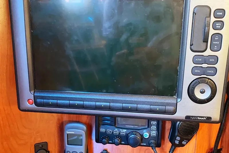 Slide: The Image of Navigation equipment on a 2012 Hunter Aft Cockpit 50 sailboat, featuring a Raymarine display. - 26