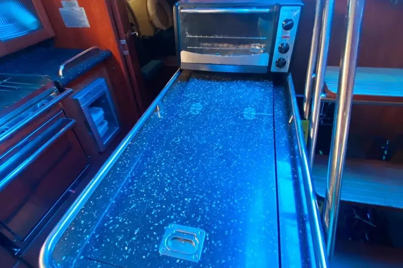 Slide: The Image of Interior of 2012 Hunter Aft Cockpit 50 yacht with modern kitchen amenities. - 30