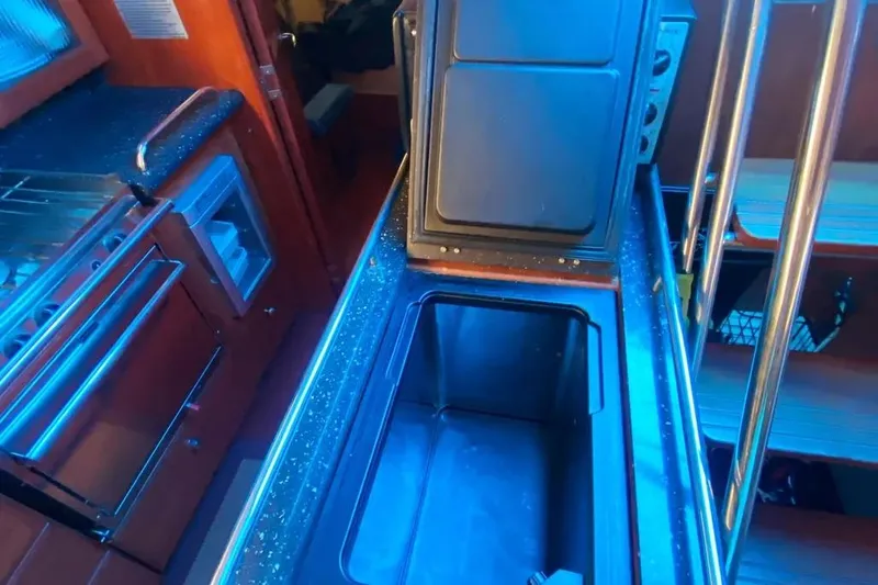 Slide: The Image of Interior of 2012 Hunter Aft Cockpit 50 yacht kitchen with open storage compartment. - 31