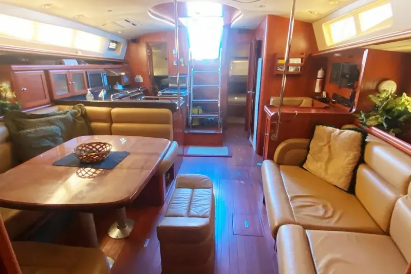 Slide: The Image of Luxurious interior of 2012 Hunter Aft Cockpit 50 yacht with elegant seating and dining area. - 7