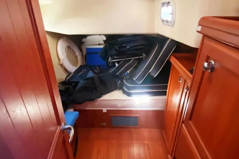 Slide: The Image of Interior cabin of 2012 Hunter Aft Cockpit 50 yacht with wooden finish and storage. - 8
