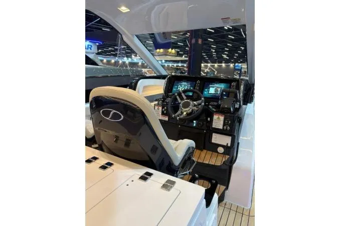 Slide: The Image of Schaefer V34 2027 boat cockpit with modern controls and steering wheel. - 11