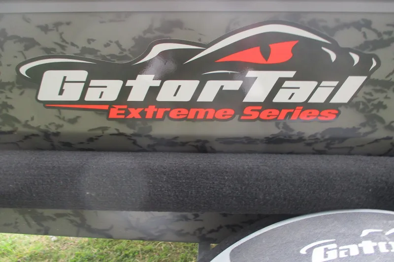 Slide: The Image of Gator Tail 1854 Extreme Series logo on camouflage background, 2026 model. - 11