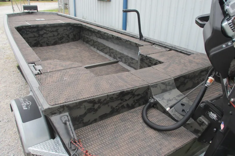 Slide: The Image of 2026 Gator Tail 1854 Extreme boat interior with camo design and motor detail. - 3