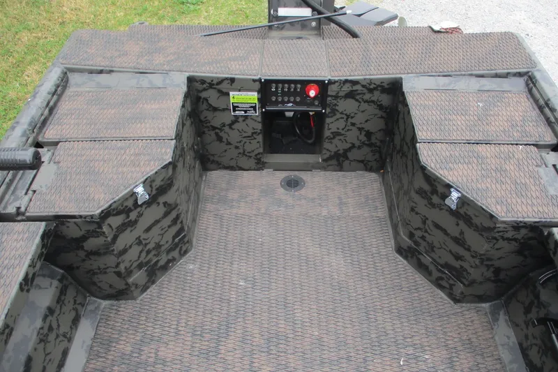 Slide: The Image of 2026 Gator Tail 1854 Extreme boat interior with camouflage design and control panel. - 5