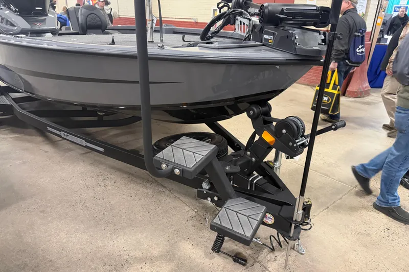 Slide: The Image of 2026 Vexus AVX 1985s boat on display with trailer and accessories. - 2