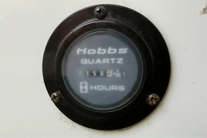 Slide: The Image of Hobbs Quartz hour meter showing 1504.1 hours on a 2010 Colbalt 242. - 4