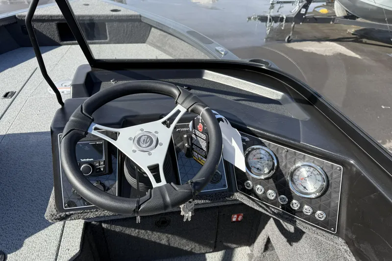Slide: The Image of Steering console of 2026 Crestliner 1850 Fish Hawk WT boat with gauges and controls. - 13