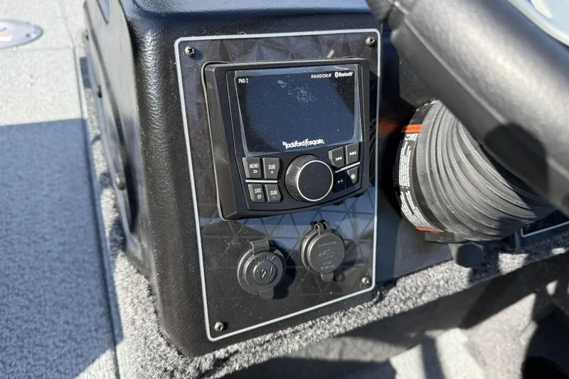 Slide: The Image of 2026 Crestliner 1850 Fish Hawk WT dashboard with Rockford Fosgate audio system and controls. - 14