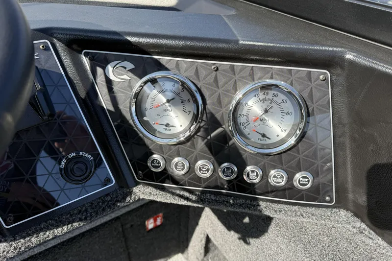 Slide: The Image of Dashboard of 2026 Crestliner 1850 Fish Hawk WT with gauges and control buttons. - 15