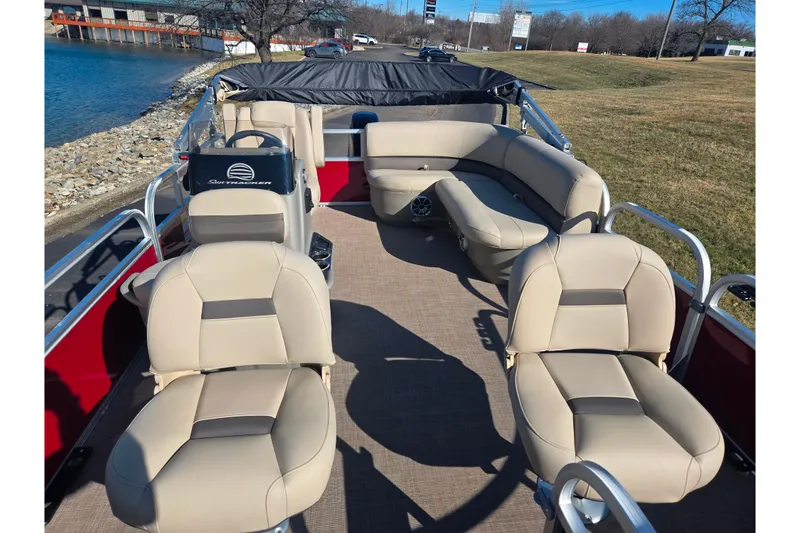 Slide: The Image of 2024 Sun Tracker Bass Buggy 16 XL Select pontoon boat with beige seating and open deck. - 10
