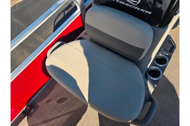 Slide: The Image of 2024 Sun Tracker Bass Buggy 16 XL Select seat with cup holders and red paneling. - 12