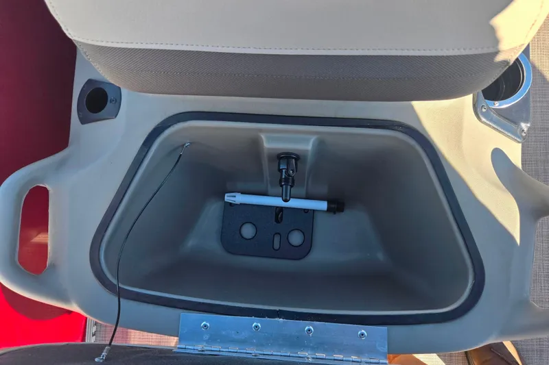 Slide: The Image of 2024 Sun Tracker Bass Buggy 16 XL Select storage compartment with cup holders and accessories. - 13