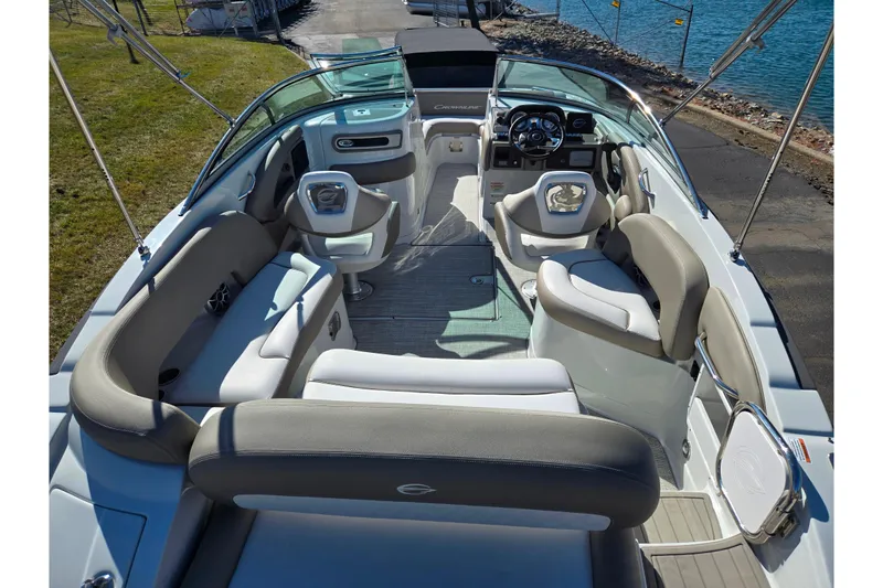 Slide: The Image of 2020 Crownline Eclipse E235 boat interior with spacious seating and modern dashboard. - 11