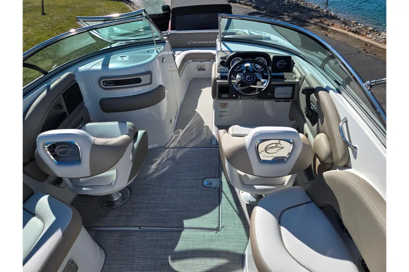 Slide: The Image of 2020 Crownline Eclipse E235 boat interior with modern seating and steering wheel. - 12