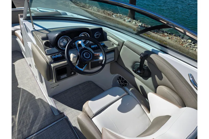 Slide: The Image of Interior of 2020 Crownline Eclipse E235 boat with steering wheel and dashboard. - 14