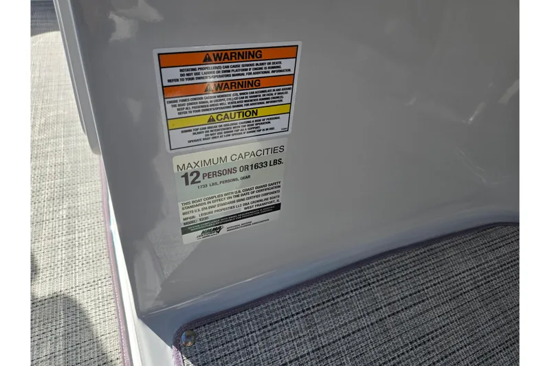 Slide: The Image of 2020 Crownline Eclipse E235 capacity warning label, maximum 12 persons or 1633 lbs. - 19