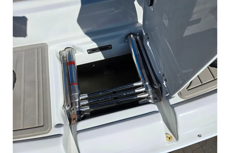 Slide: The Image of 2020 Crownline Eclipse E235 boat with foldable stainless steel ladder. - 23