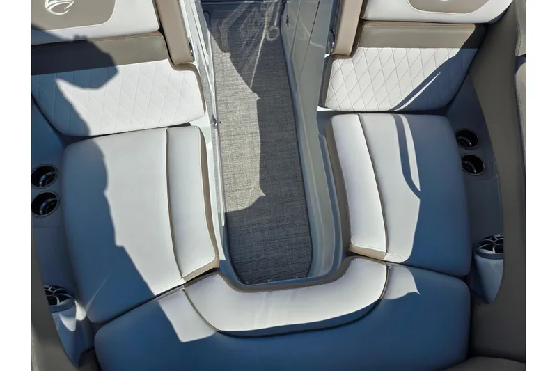Slide: The Image of 2020 Crownline Eclipse E235 boat interior with white and beige seating. - 24